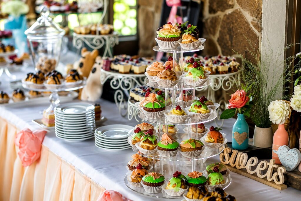 Cupcake and dessert table prepared for a catered celebration