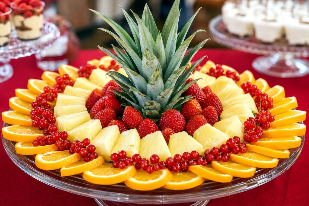 Fresh fruit platter with pineapple strawberries oranges and berries
