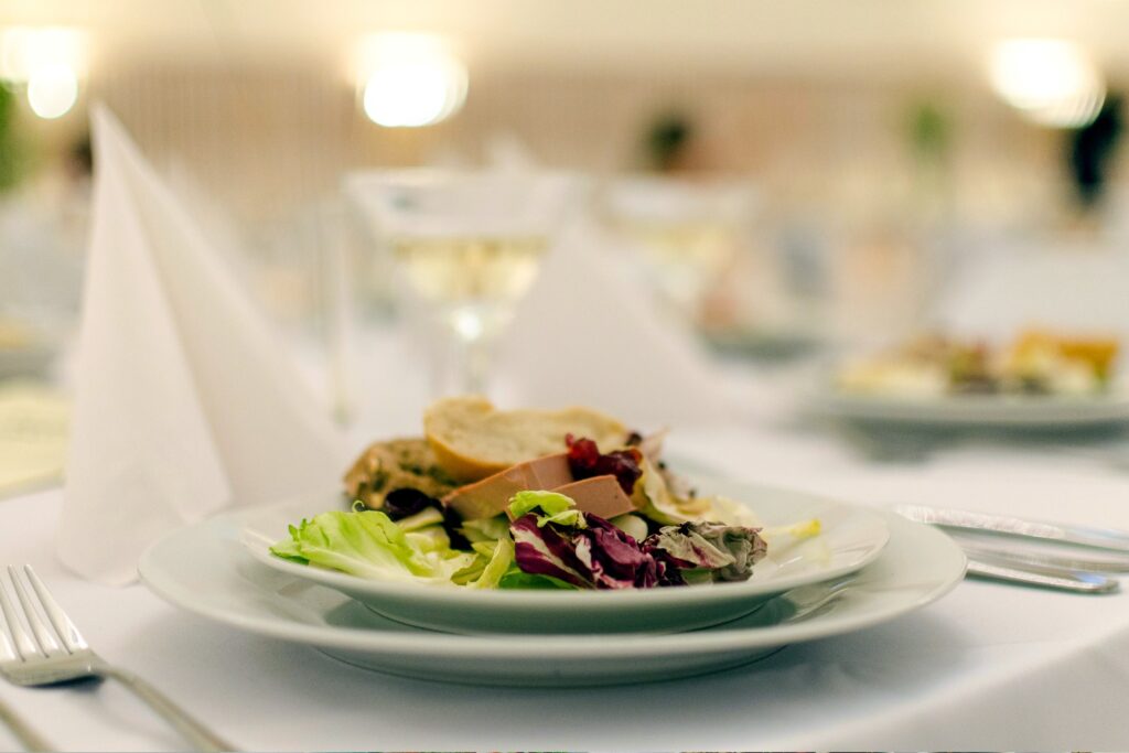 Fresh plated salad prepared for an event table